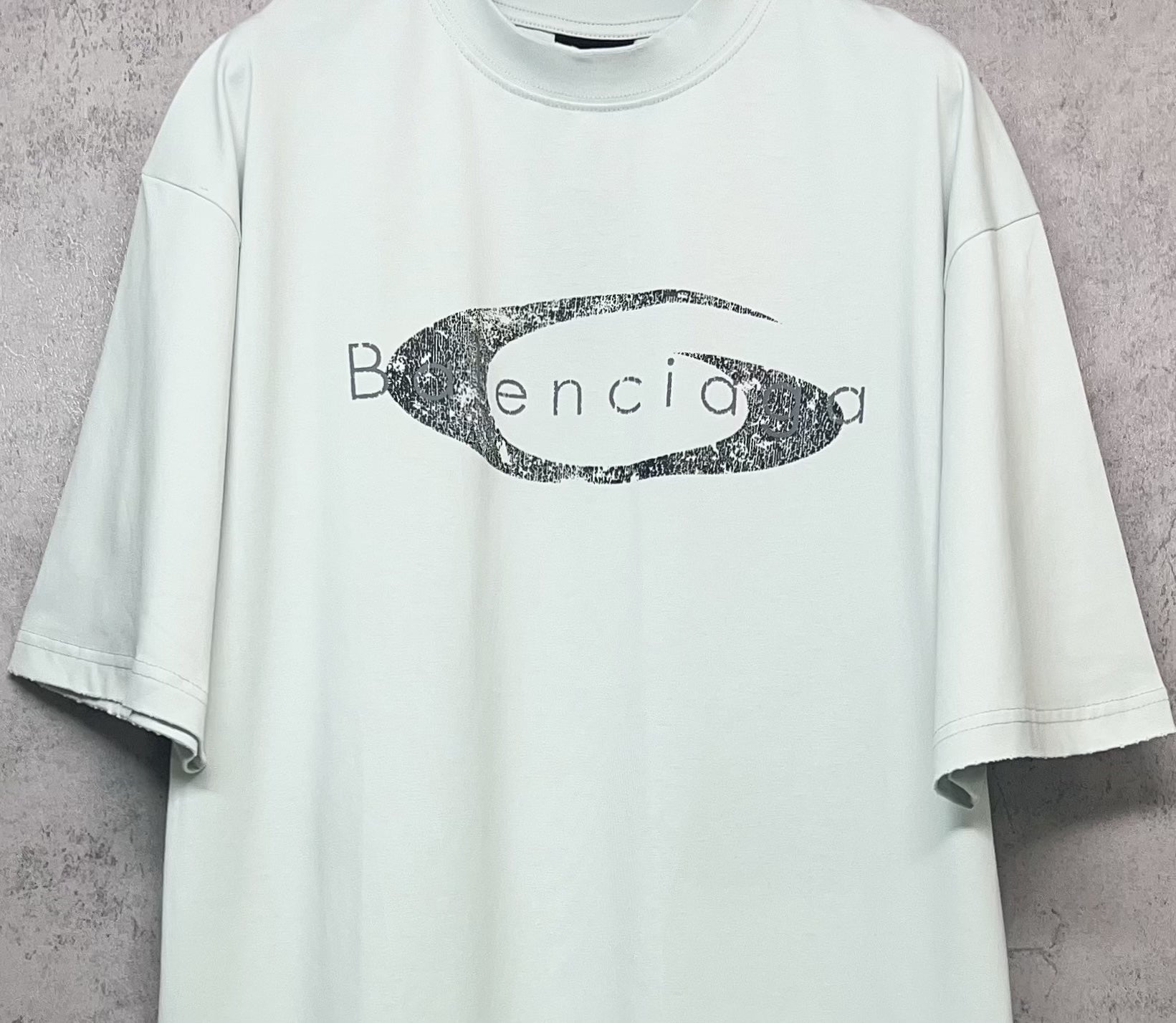 Balenciaga short-sleeve T-shirt in light mint with oval graphic logo print, front close-up