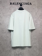 Balenciaga short-sleeve T-shirt in light mint, back view on hanger