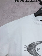 Balenciaga short-sleeve T-shirt in light mint with partial oval graphic logo print, side angle