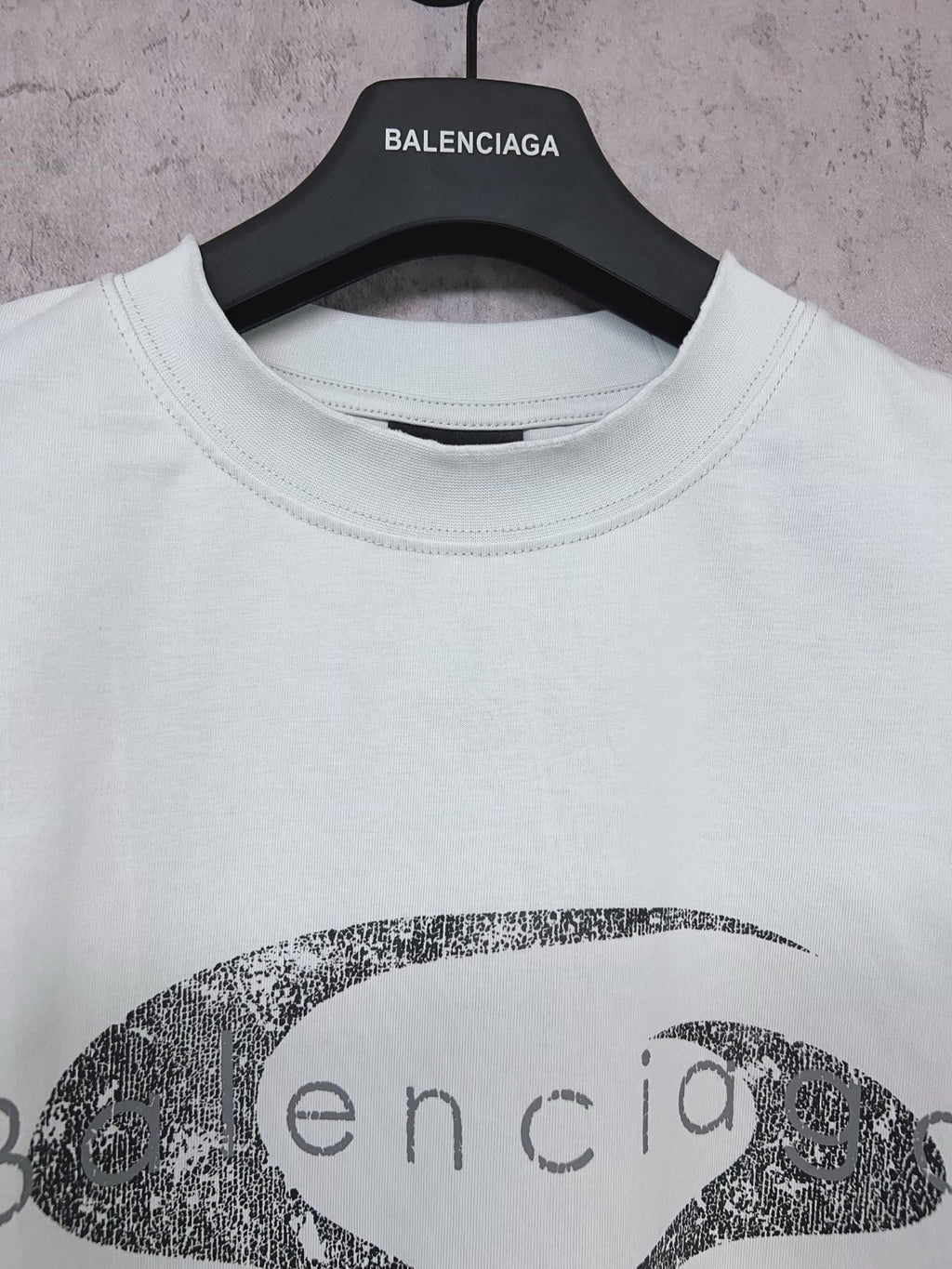 Balenciaga short-sleeve T-shirt in light mint with oval graphic logo print, neck close-up