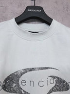 Balenciaga short-sleeve T-shirt in light mint with oval graphic logo print, neck close-up