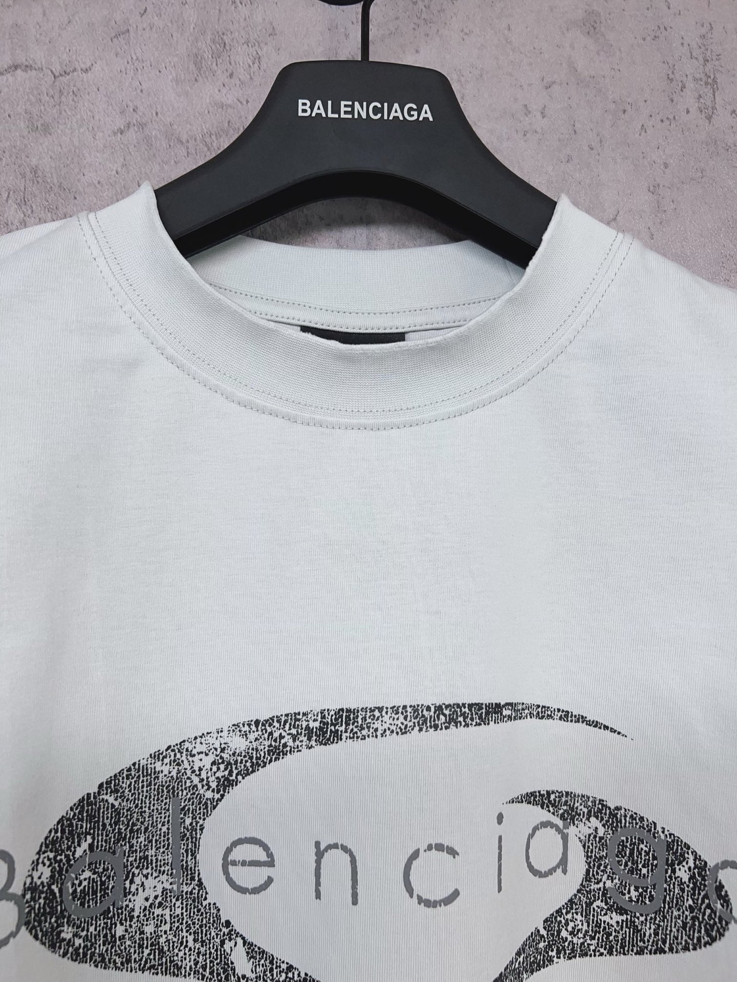 Balenciaga short-sleeve T-shirt in light mint with oval graphic logo print, neck close-up