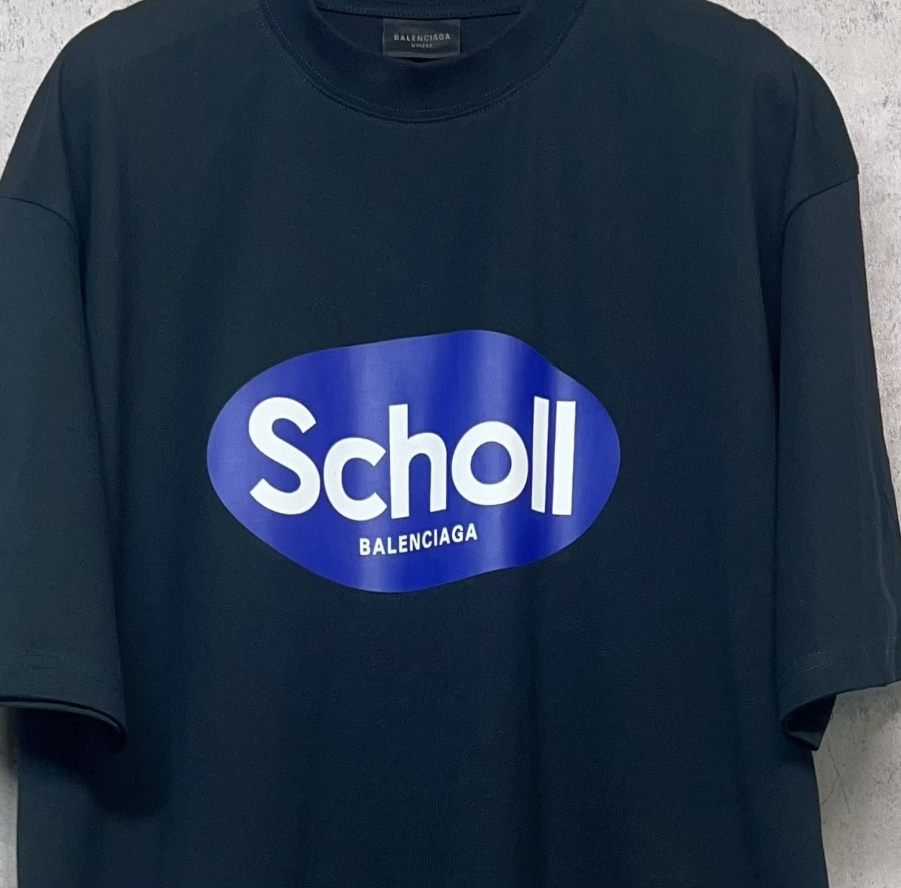 Balenciaga short-sleeve T-shirt, dark navy, close-up of “Scholl” front logo print