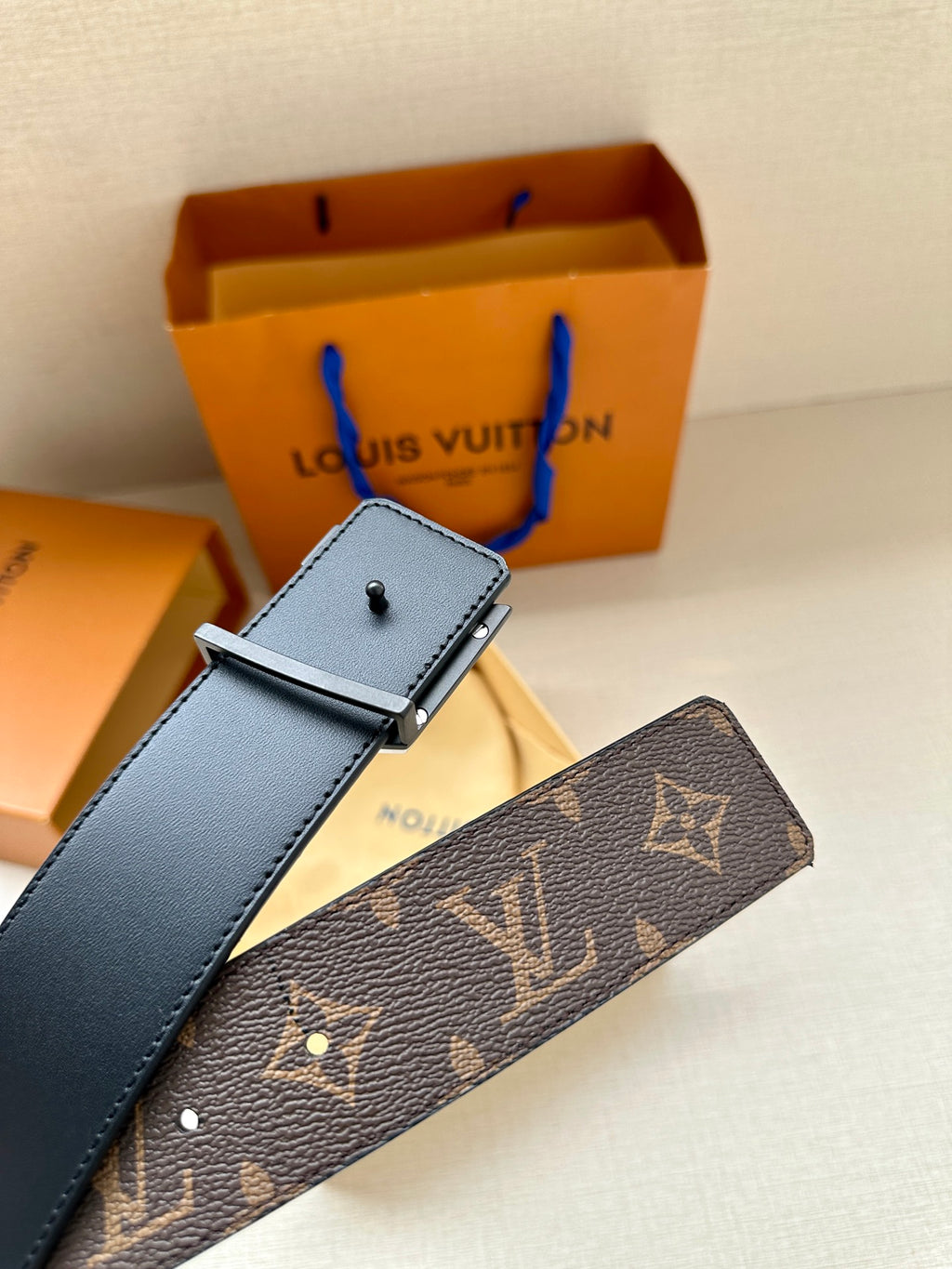 Louis Vuitton belt with square silver buckle on blue leather and dark monogram belt
