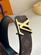 Louis Vuitton monogram belt detail: gold buckle on dark brown leather strap