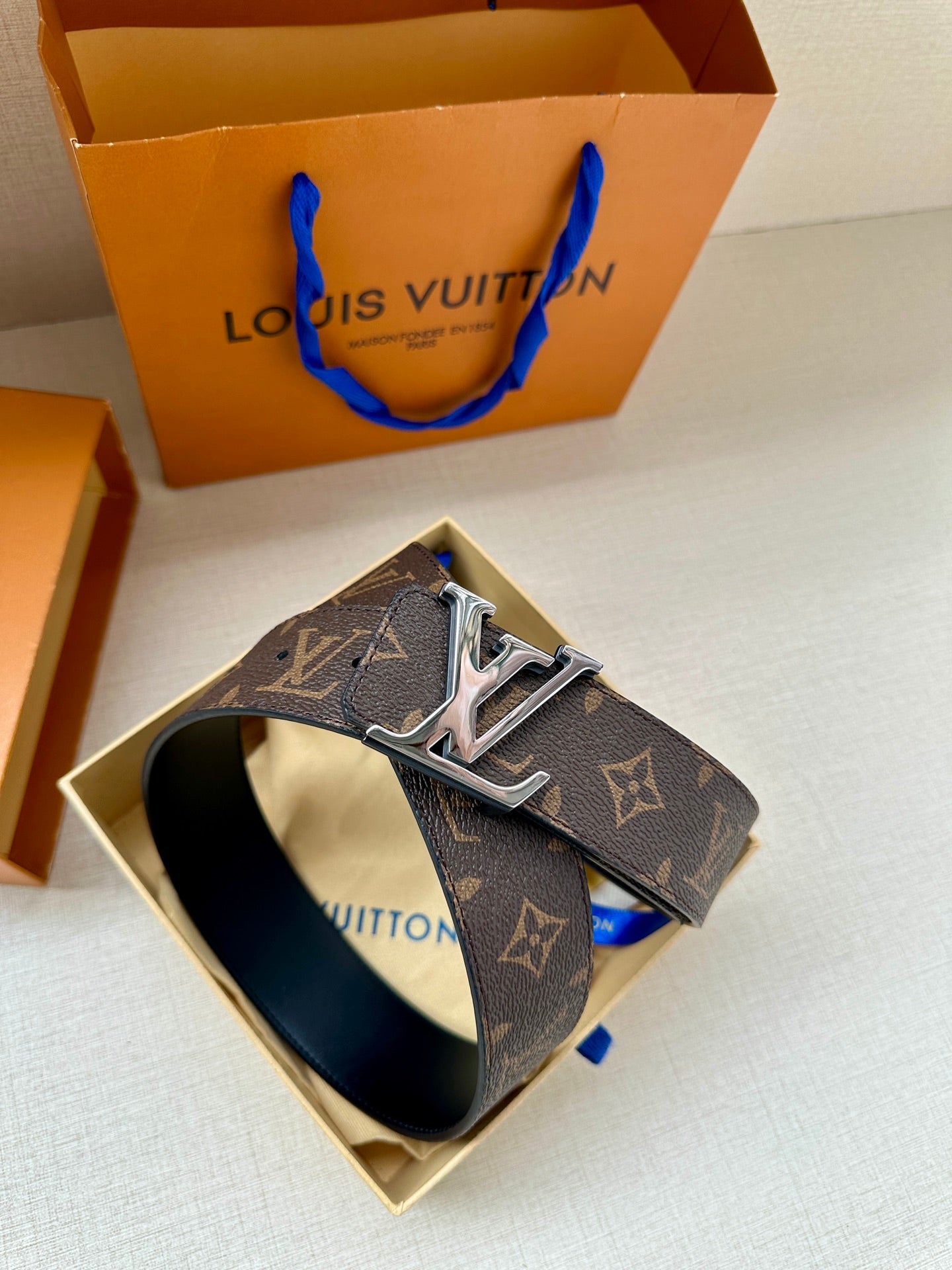 Louis Vuitton monogram belt in box, silver-toned buckle on dark brown leather