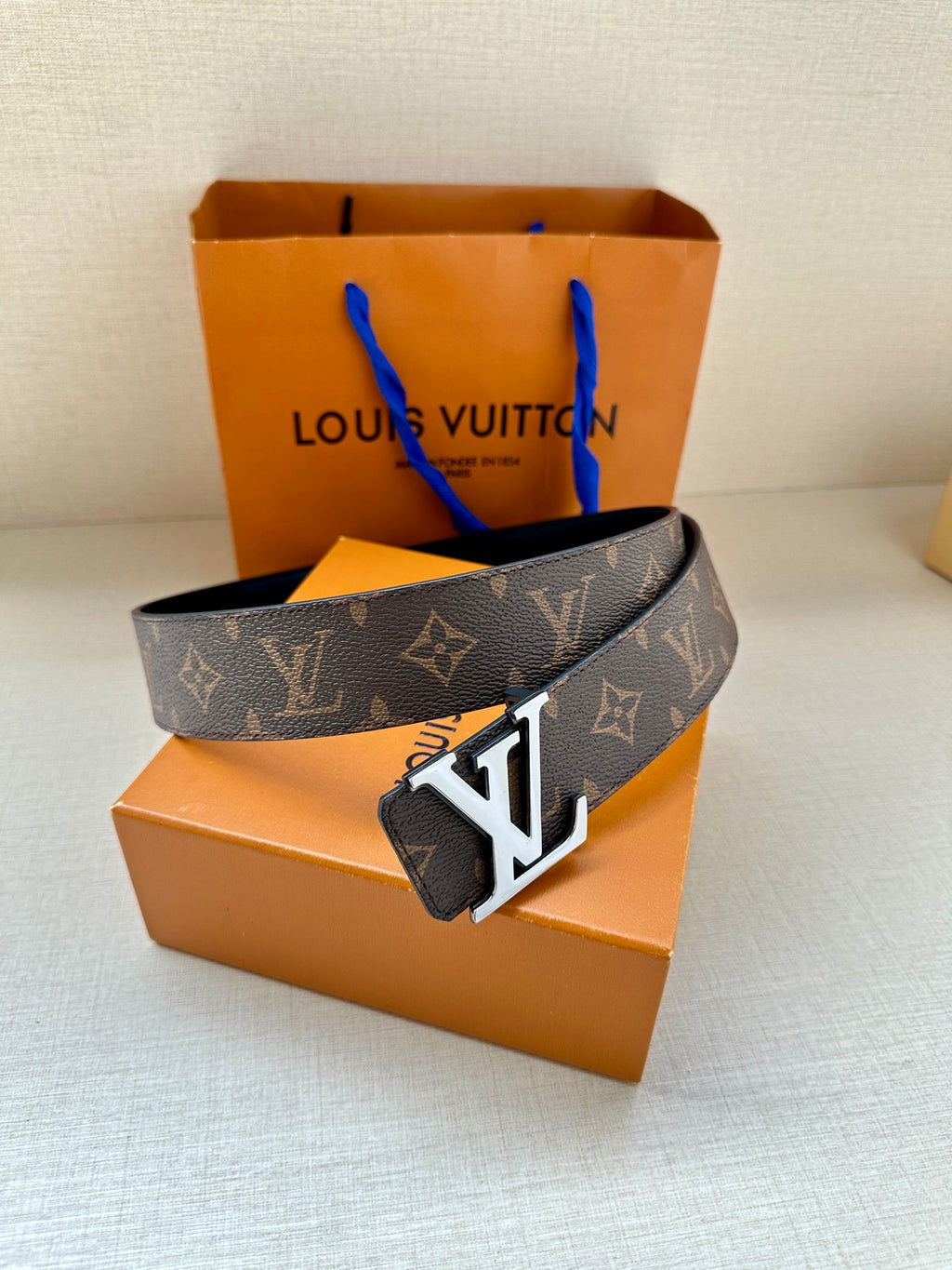 Louis Vuitton monogram belt with large gold buckle, dark brown leather
