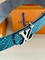 Louis Vuitton belt close-up: turquoise dotted strap with gold LV buckle