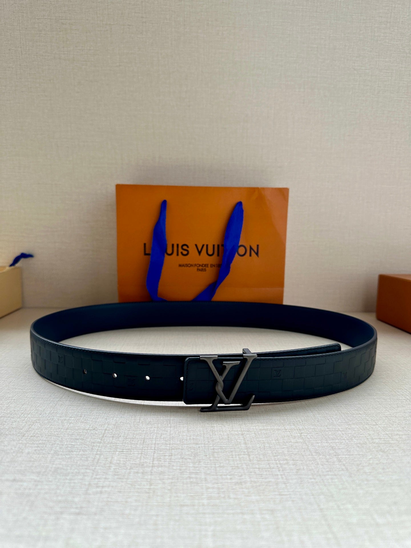 Louis Vuitton belt in dark navy with LV silver-tone buckle