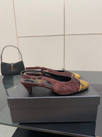 Women’s low-heel flats, burgundy suede with gold toe cap and red laces, side view.