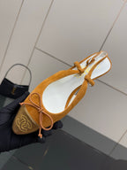 Tan suede flats with lace-up bows and CHANEL logo on toe, kitten heel