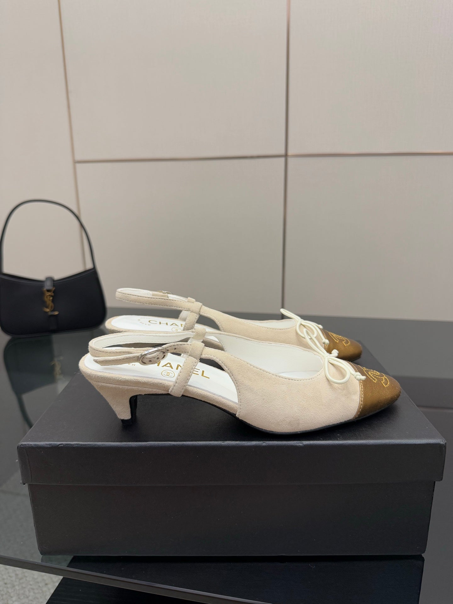 Women’s slingback heels with low heel, white uppers and gold toe cap with laces