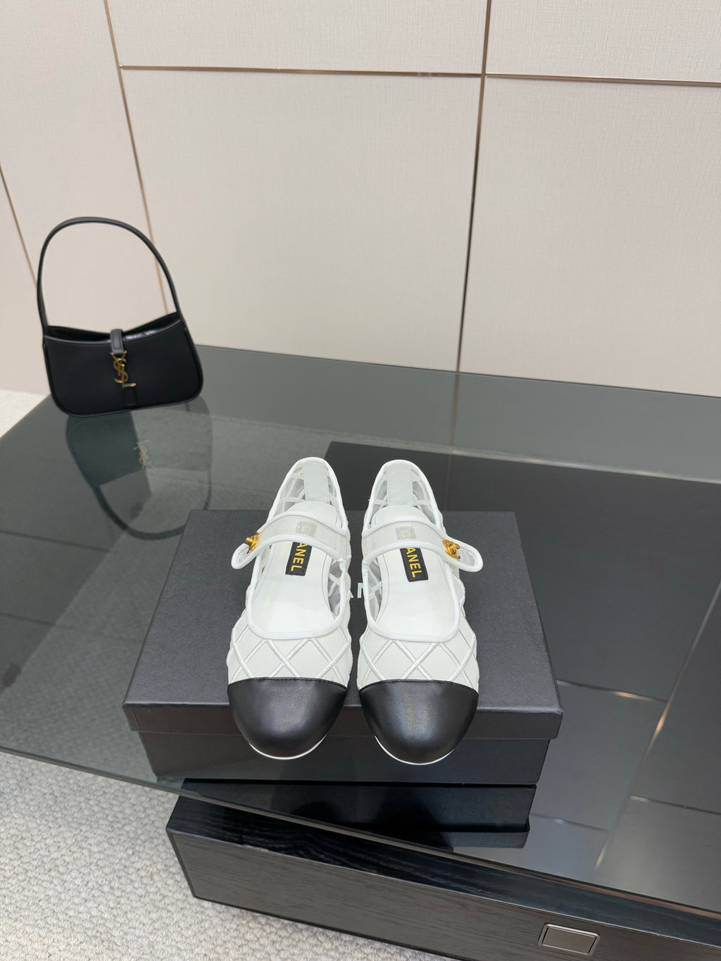 White lattice lace-up sneakers with black toe and gold Chanel emblem