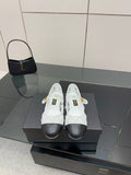 White lattice lace-up sneakers with black toe and gold Chanel emblem