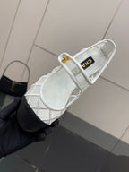 White lattice lace-up sneaker with black toe, CHANEL label on inner lining