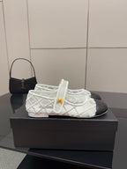 White lattice lace-up sneaker with black heel panel and gold Chanel badge