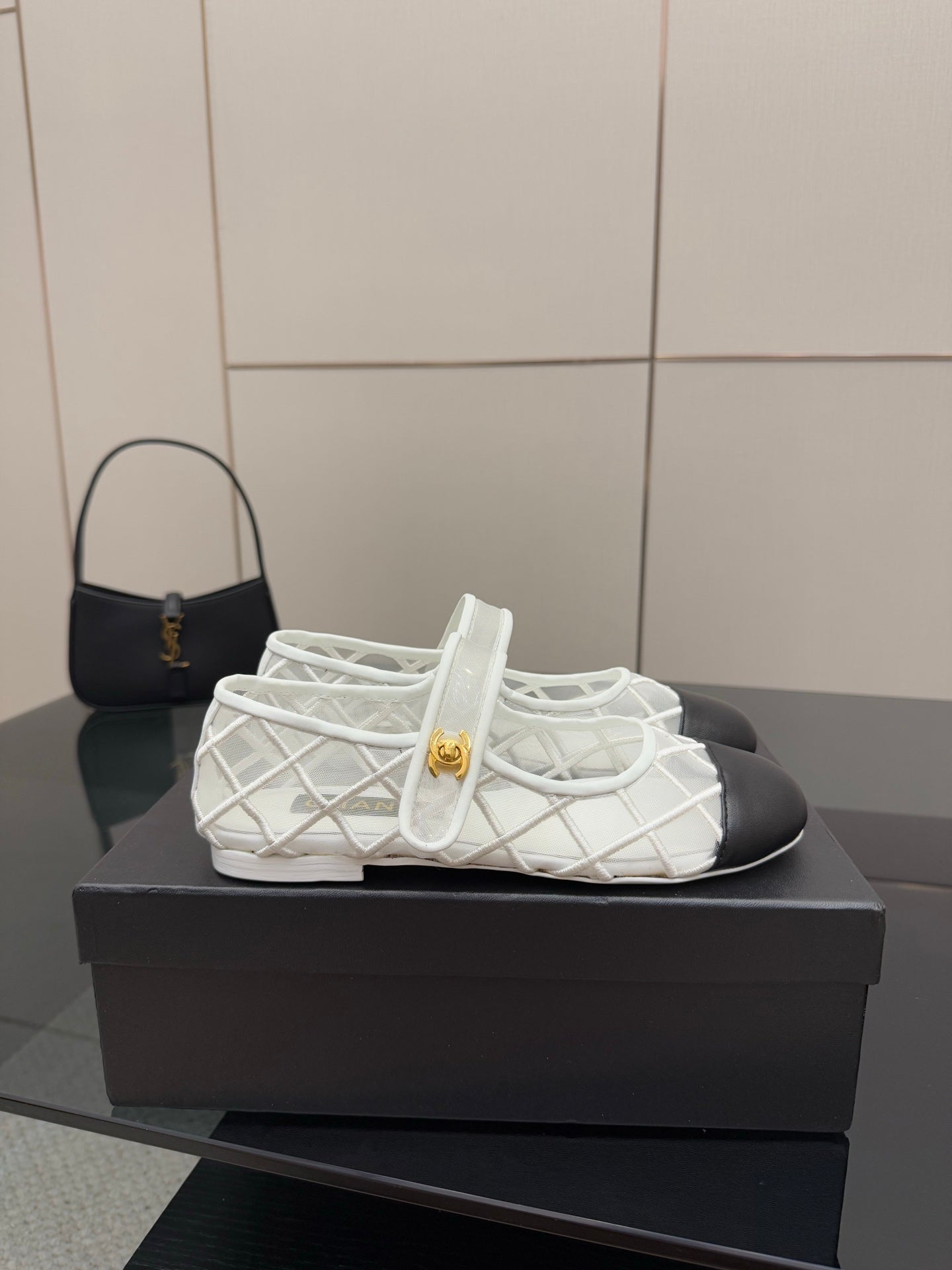 White lattice lace-up sneaker with black heel panel and gold Chanel badge
