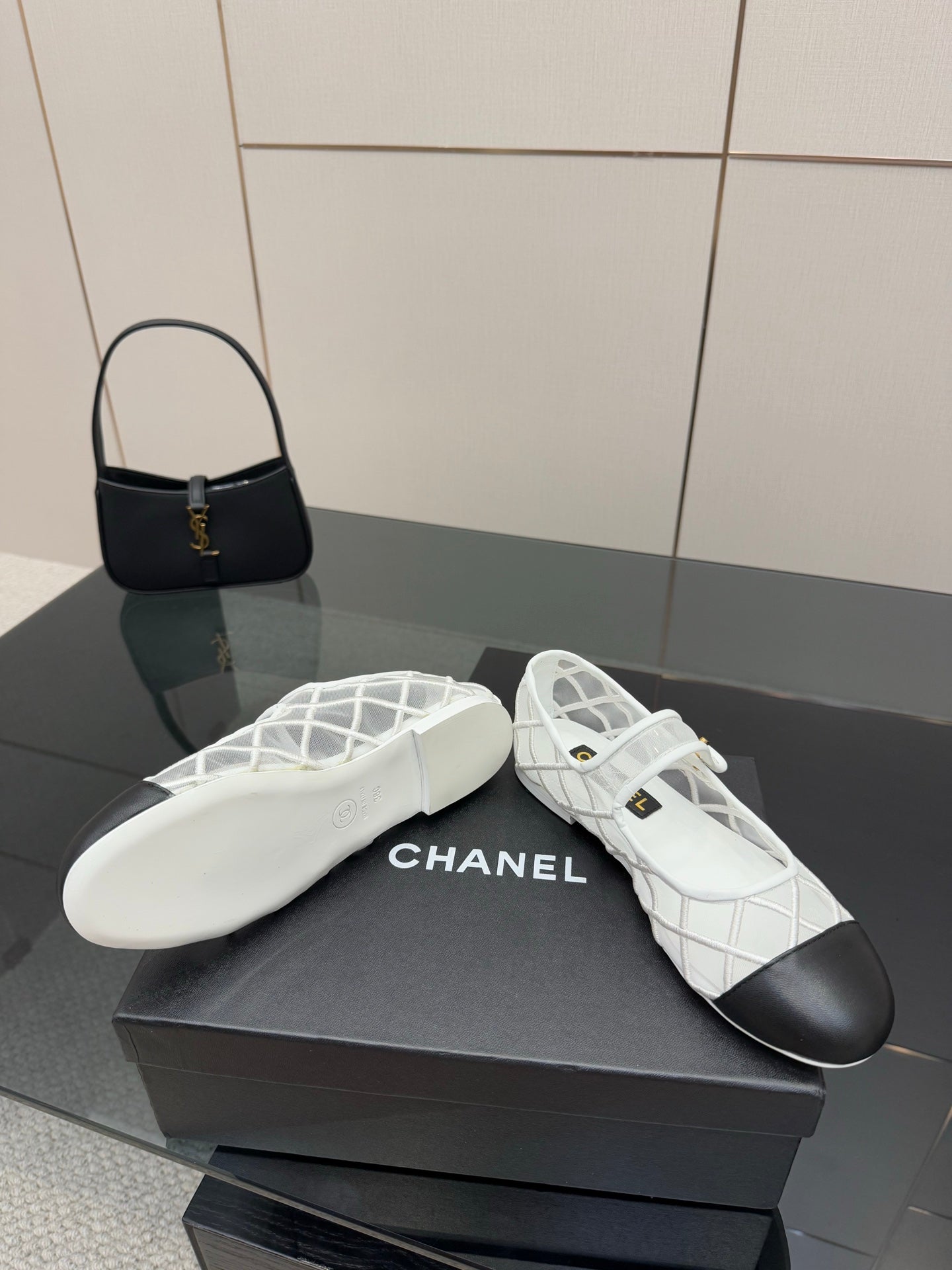 White lattice lace-up sneakers with black toe, CHANEL logo on insole