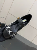 Black Chanel flats with adjustable strap, white lattice panel and gold logo charm