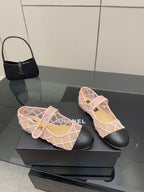 Pink mesh flats with white crisscross straps, black soles, gold logo charm