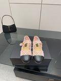 Pink slingback flats with white lattice straps and black toe caps