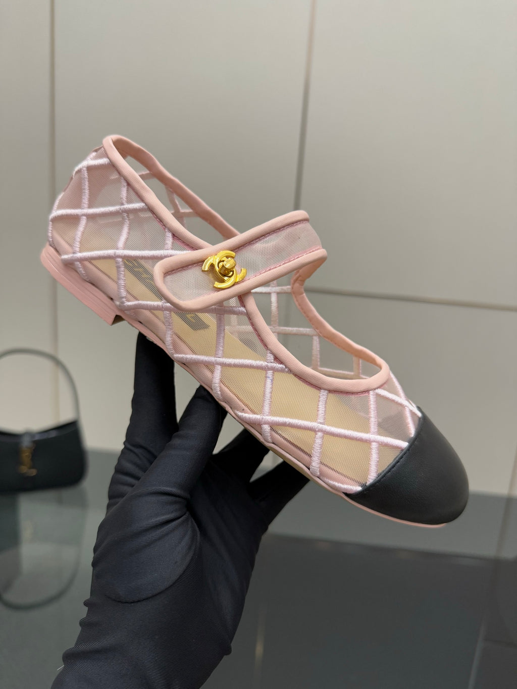 Pink lattice flat with gold clasp bar and open strap design