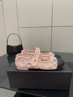 Pink mesh ballet flats with white crisscross straps and gold buckle
