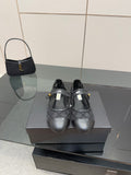 Chanel women’s black quilted flats with gold CC detail and crisscross straps