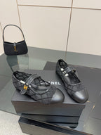 Chanel women’s black quilted flats with crisscross straps, pair on display box