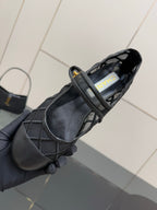Chanel women’s black quilted flats, interior view showing label at opening