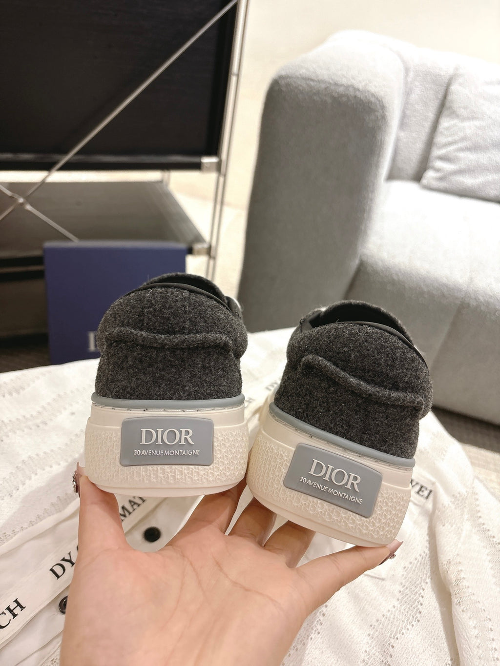 Unisex sneakers rear view with heel tabs, dark gray uppers and white midsoles