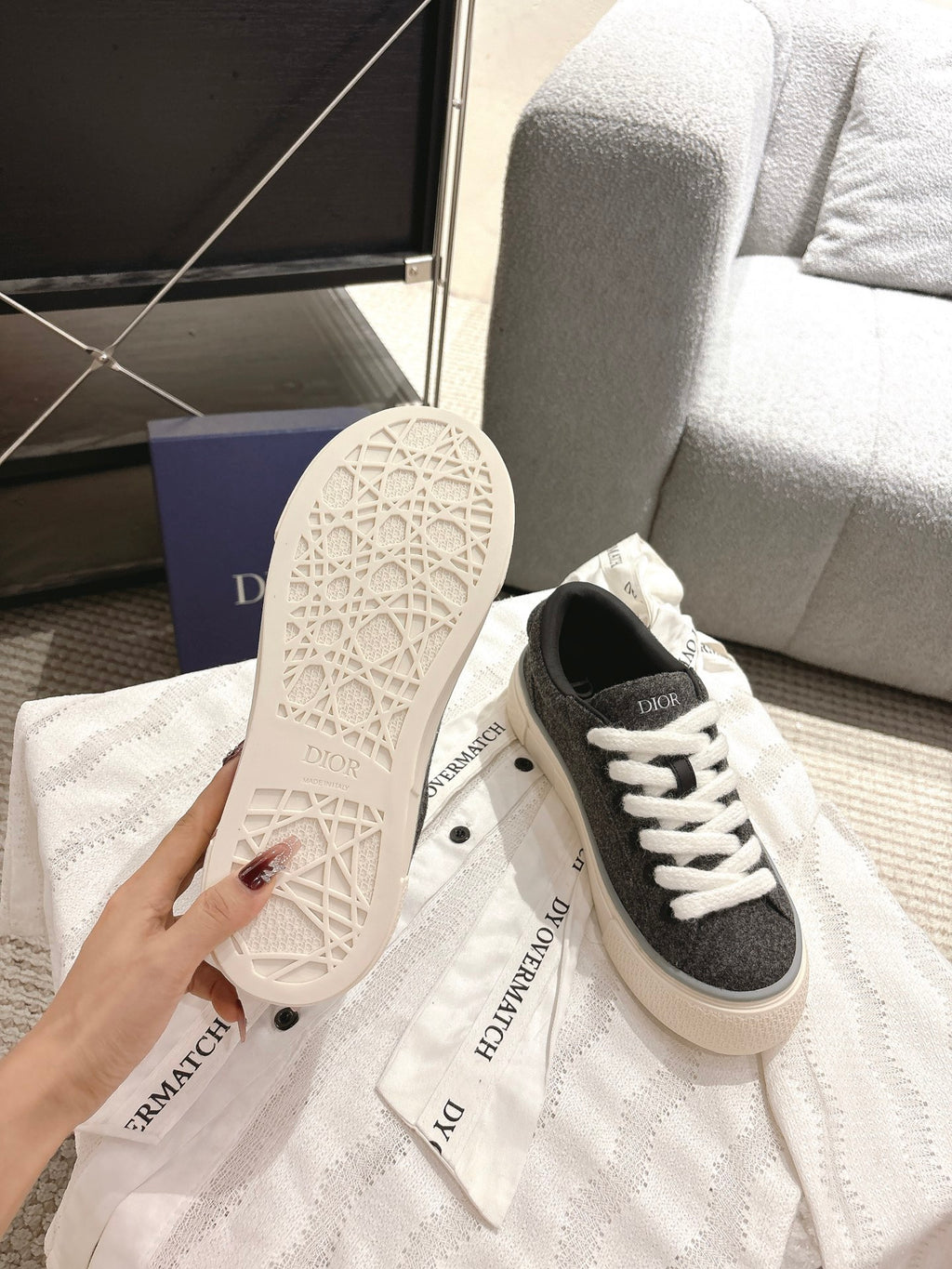 Unisex sneakers with outsole shown: dark gray upper and textured white sole