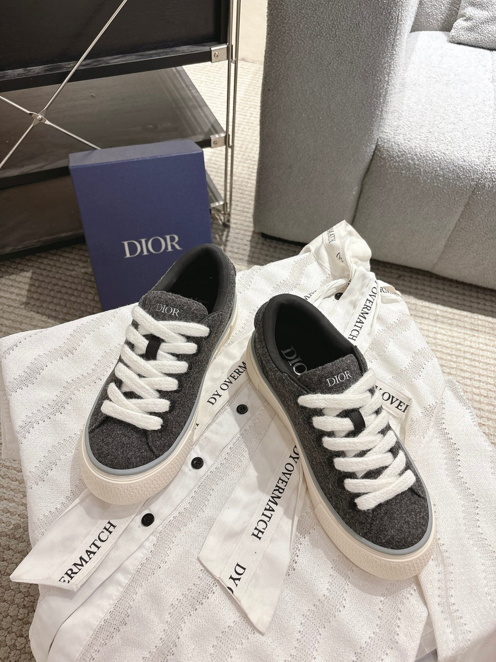 Unisex low-top sneakers, dark gray uppers with white laces and side branding