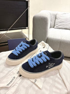 Navy and light blue lace low-top sneakers with textured white sole, DIOR logo on tongue