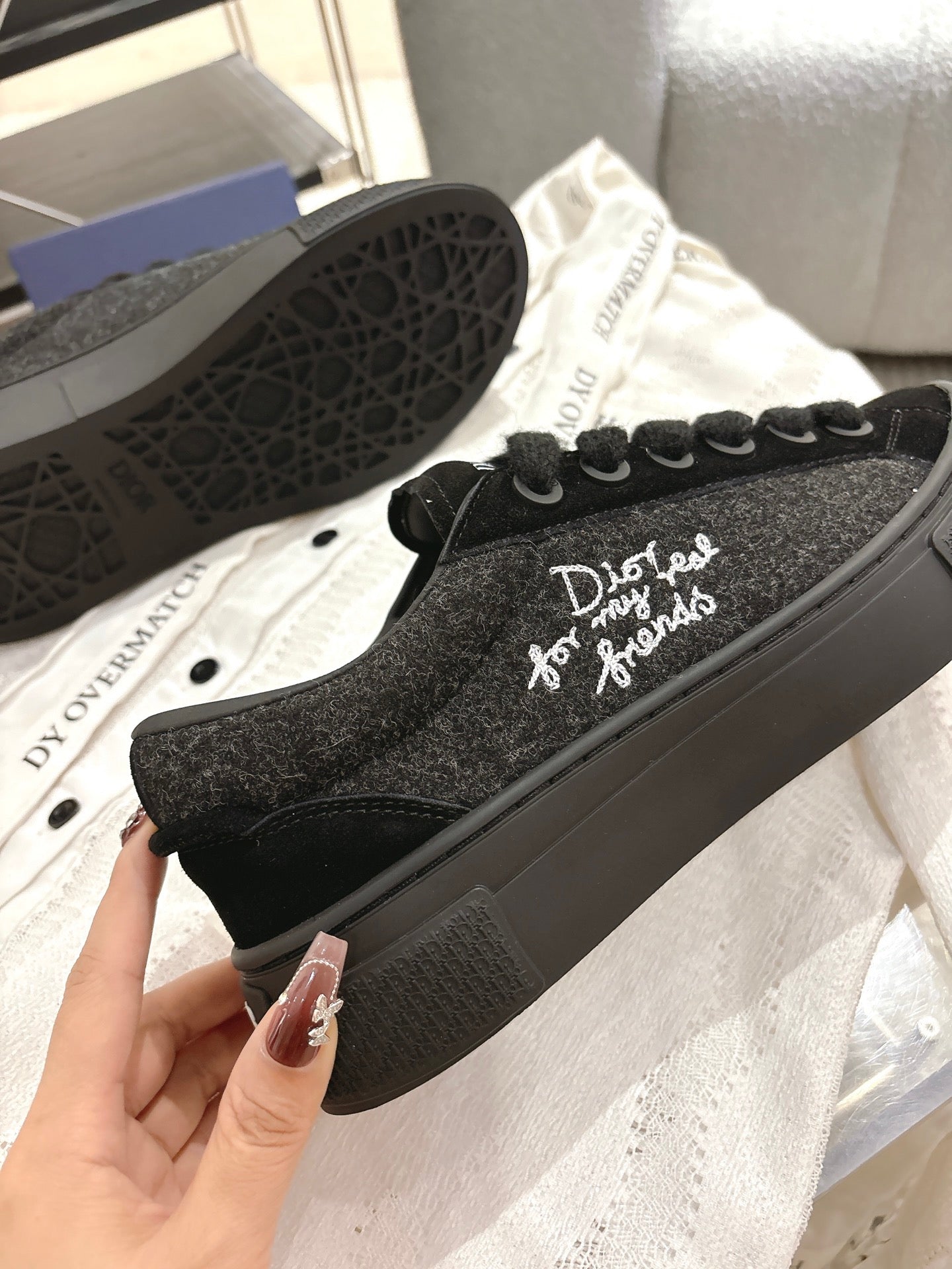 Black Dior glitter-textured low-top sneakers with side logo and black rubber sole