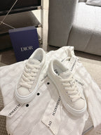 White Dior sneakers, lace-up with logo tongue detail and side branding