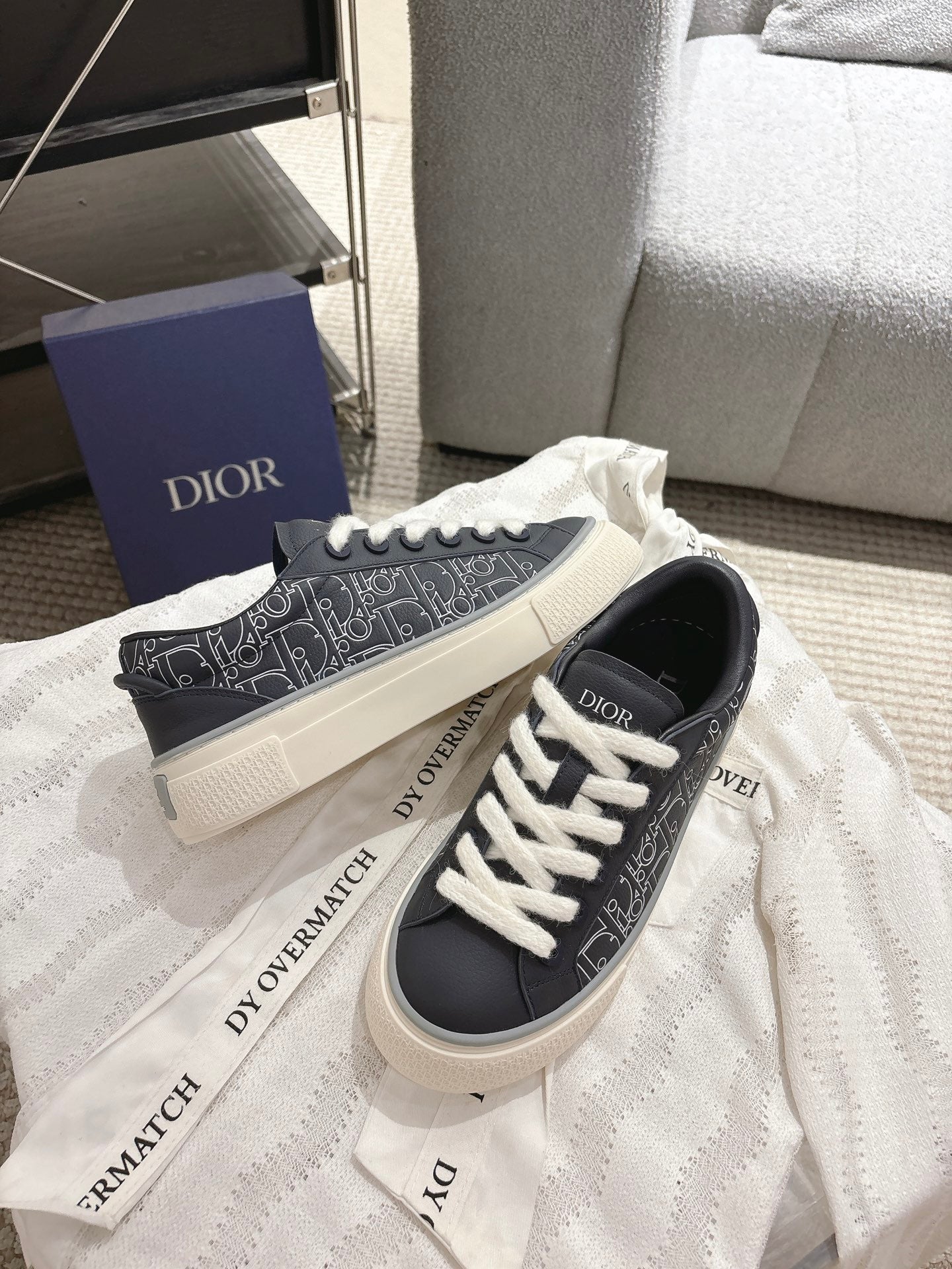 Dior unisex sneakers, black low-top with white lace-up and patterned side stripe