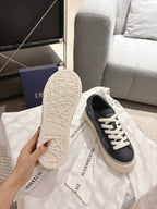 Dior unisex sneaker outsole view, textured white sole with logo lettering