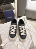 Dior unisex sneakers, black low-top with white laces and white logo pattern