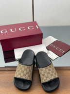 Gucci slide sandals, beige GG canvas with black straps and textured black soles