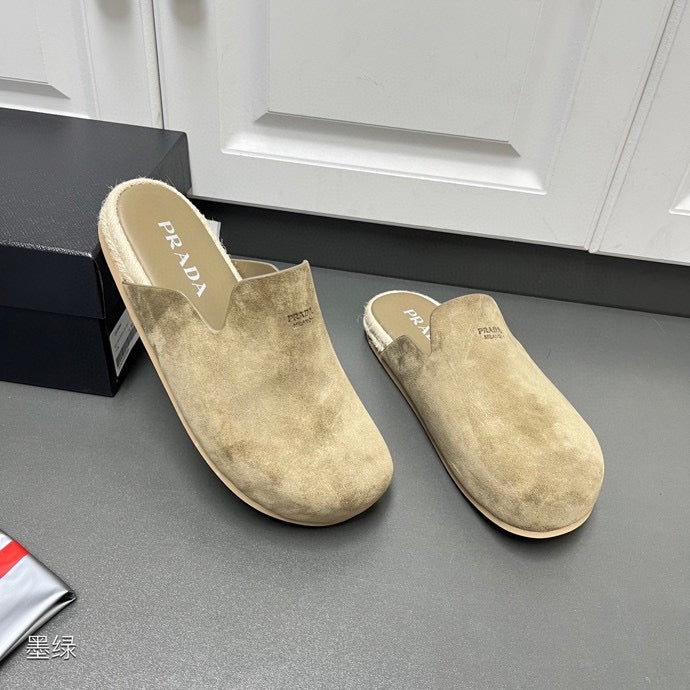 Pair of taupe suede slide sandals with PRADA logo on footbeds