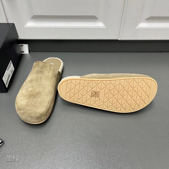 Taupe suede slide sandals with textured outsole featuring geometric pattern