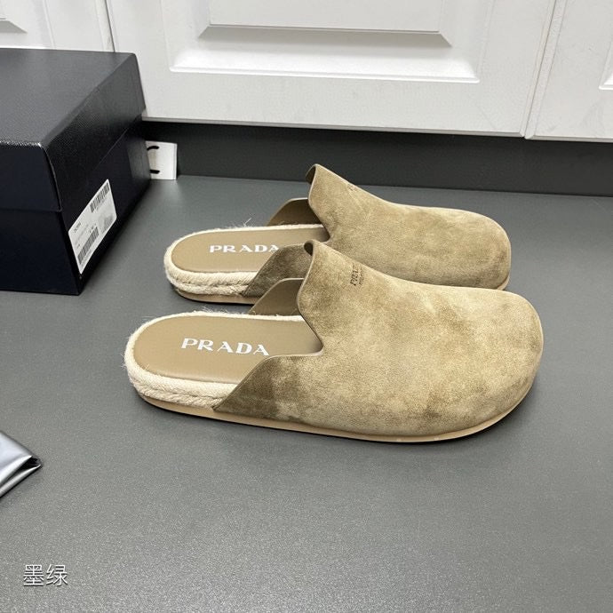 Taupe suede slide sandals with cushioned footbeds and PRADA logo