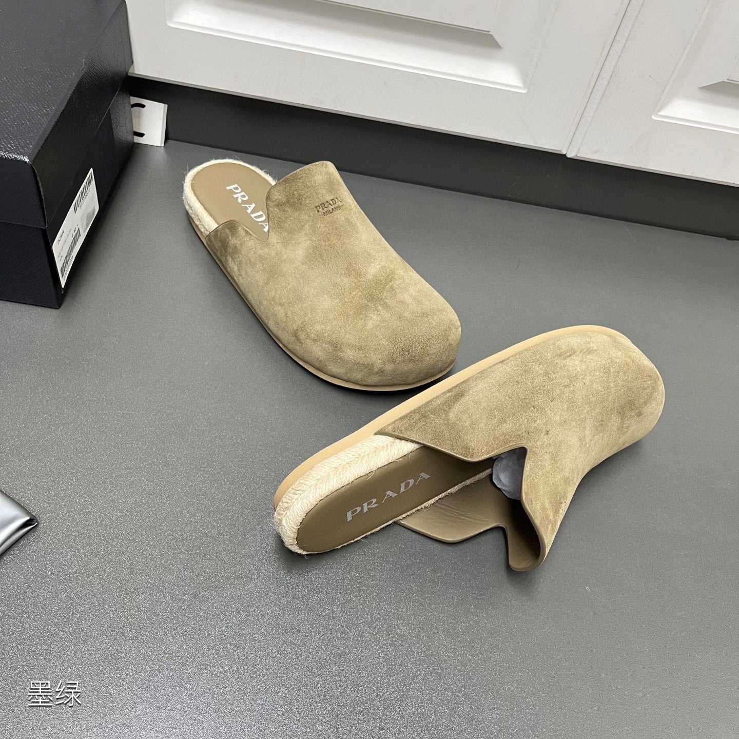 Taupe suede slide sandals with PRADA-branded insole and curved upper