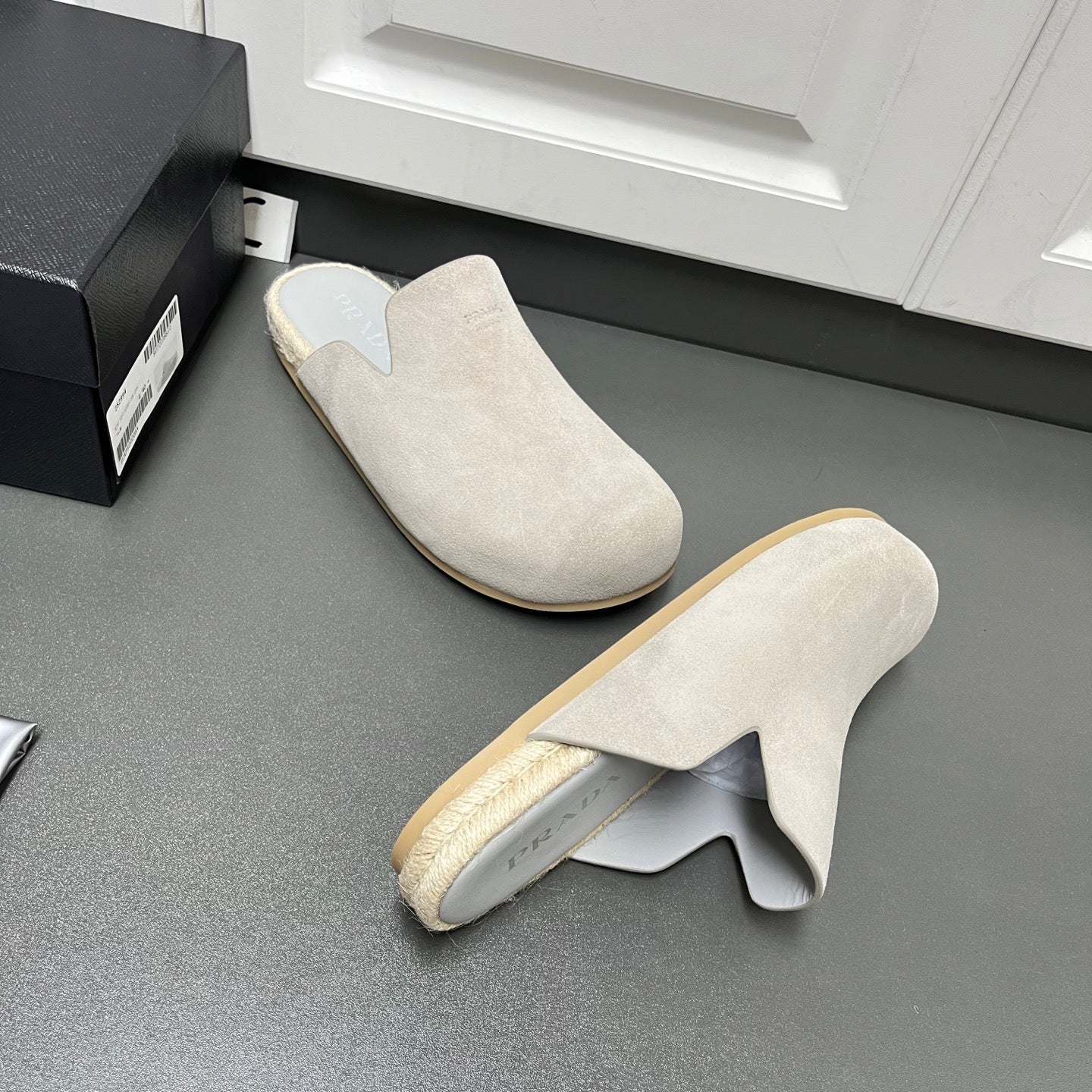 Prada light beige suede mule sandals, front and side views with jute edging