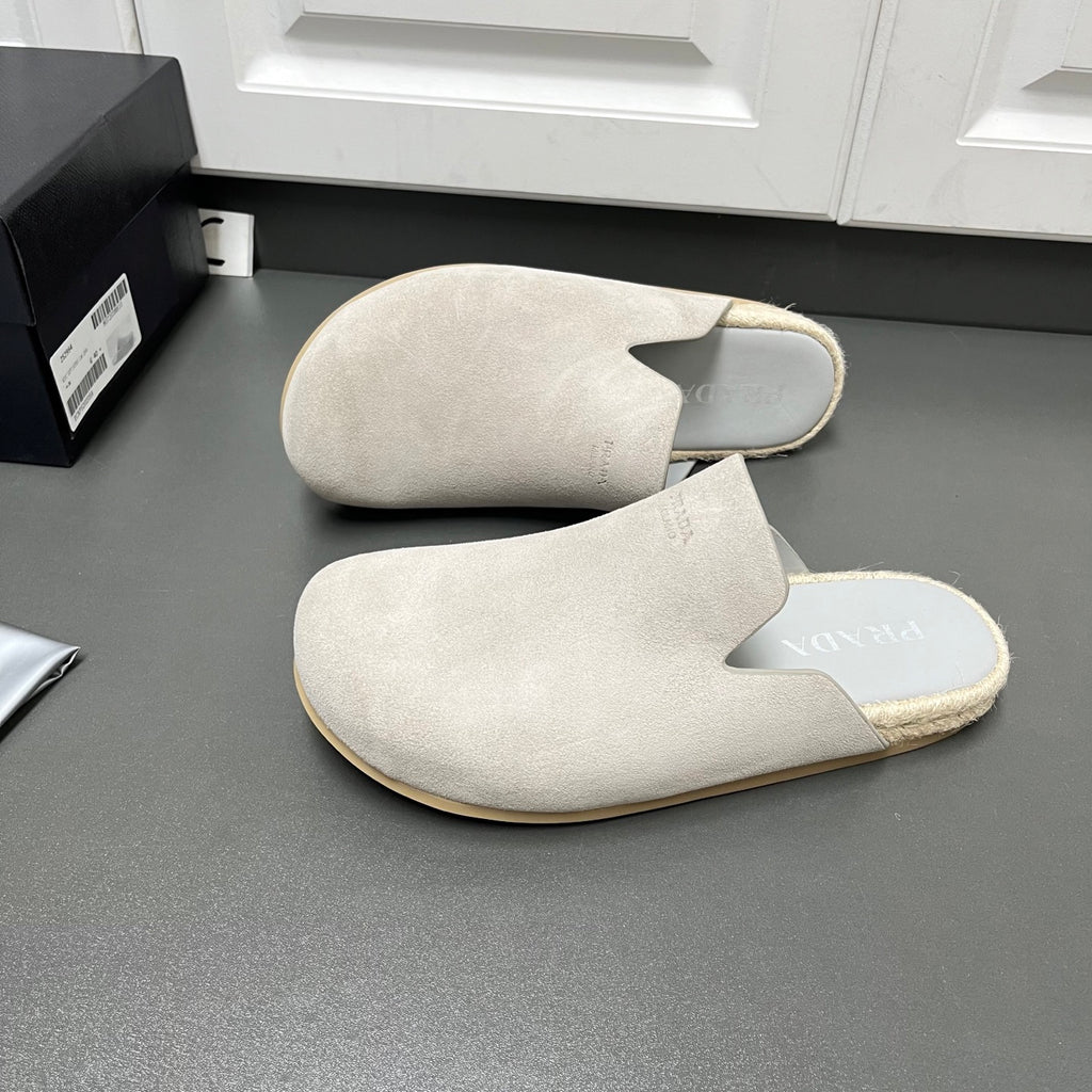 Prada light beige suede mules, closed-toe slip-on style with low profile sole