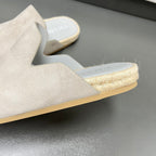 Prada light beige slip-on mule with jute-textured trim and thick sole edge
