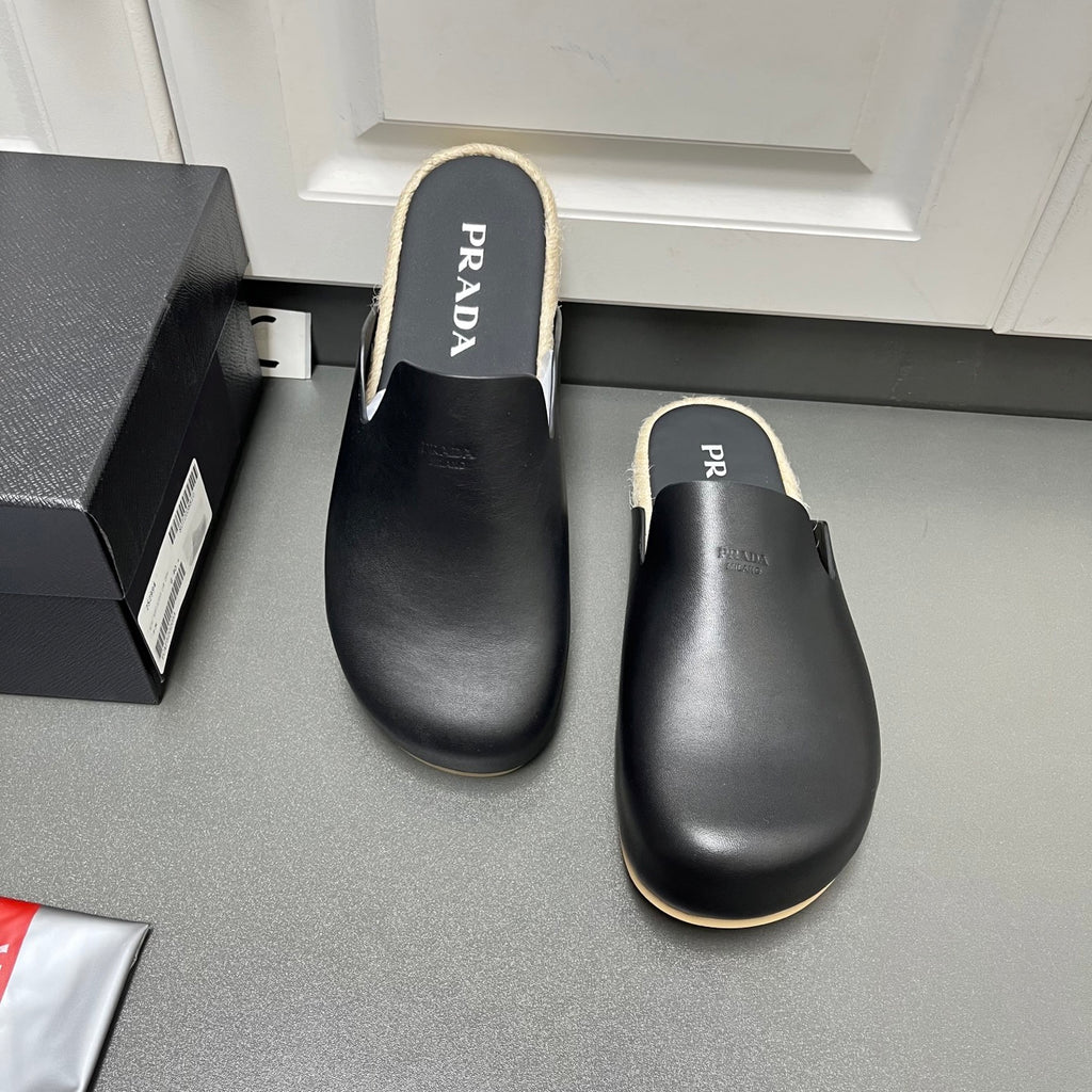 Prada leather slide sandals, black with shearling trim and cushioned footbed
