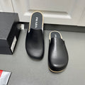 Prada leather slide sandals, black with shearling trim and cushioned footbed