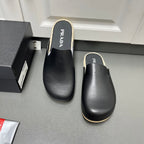 Prada leather slide sandals, black with shearling trim and cushioned footbed